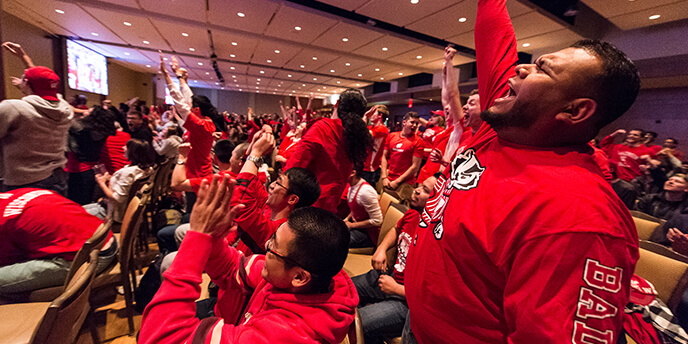 Fans cheer on at a Badger game watch