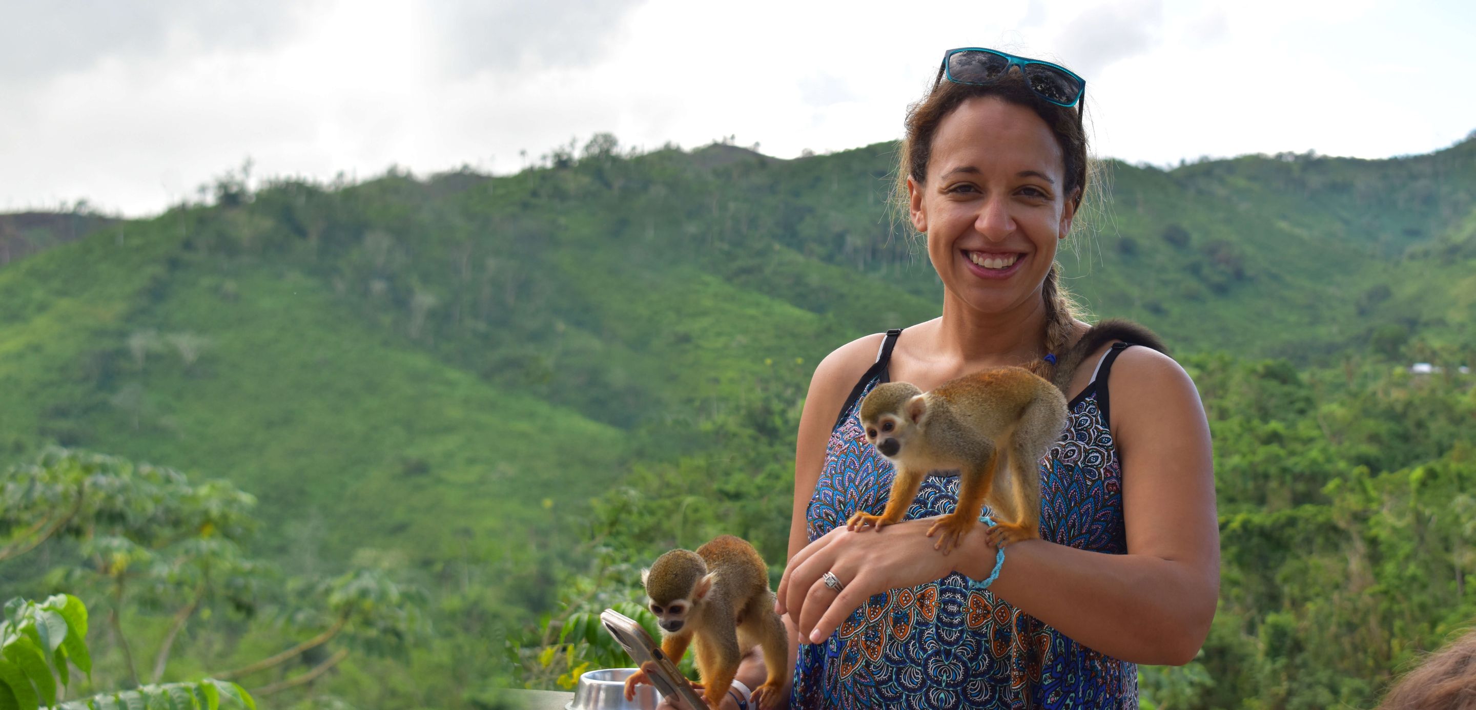 Ashleigh Davis-Bergsohn DVM’13 with two small monkeys
