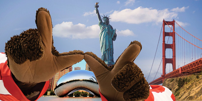 Bucky's hand in a W over famous city landmarks