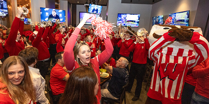 Wisconsin fans celebrate at a gathering