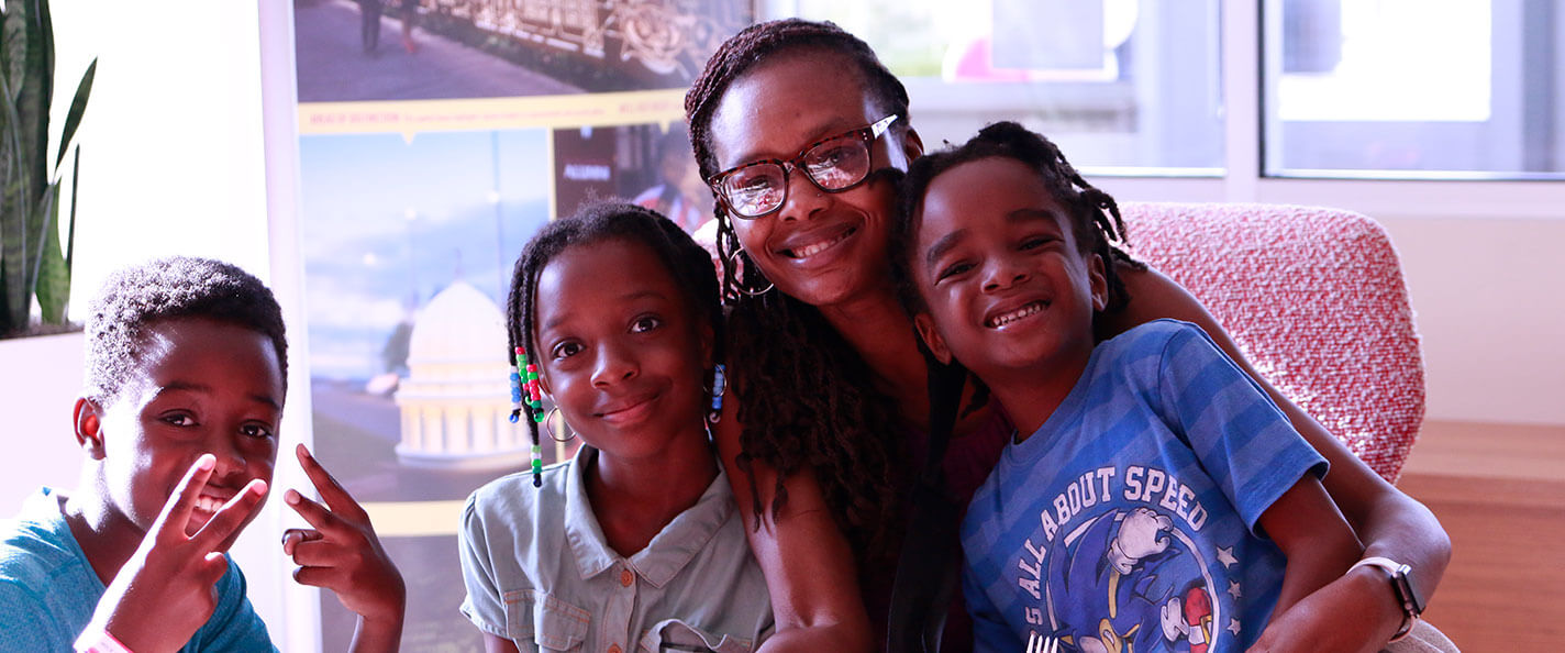 A family poses for the camera at the Affinity Group Celebration.