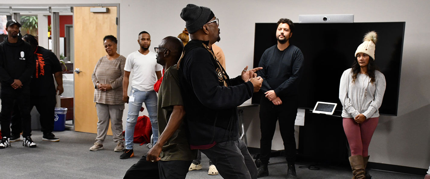 Baron Kelly leading an acting workshop.