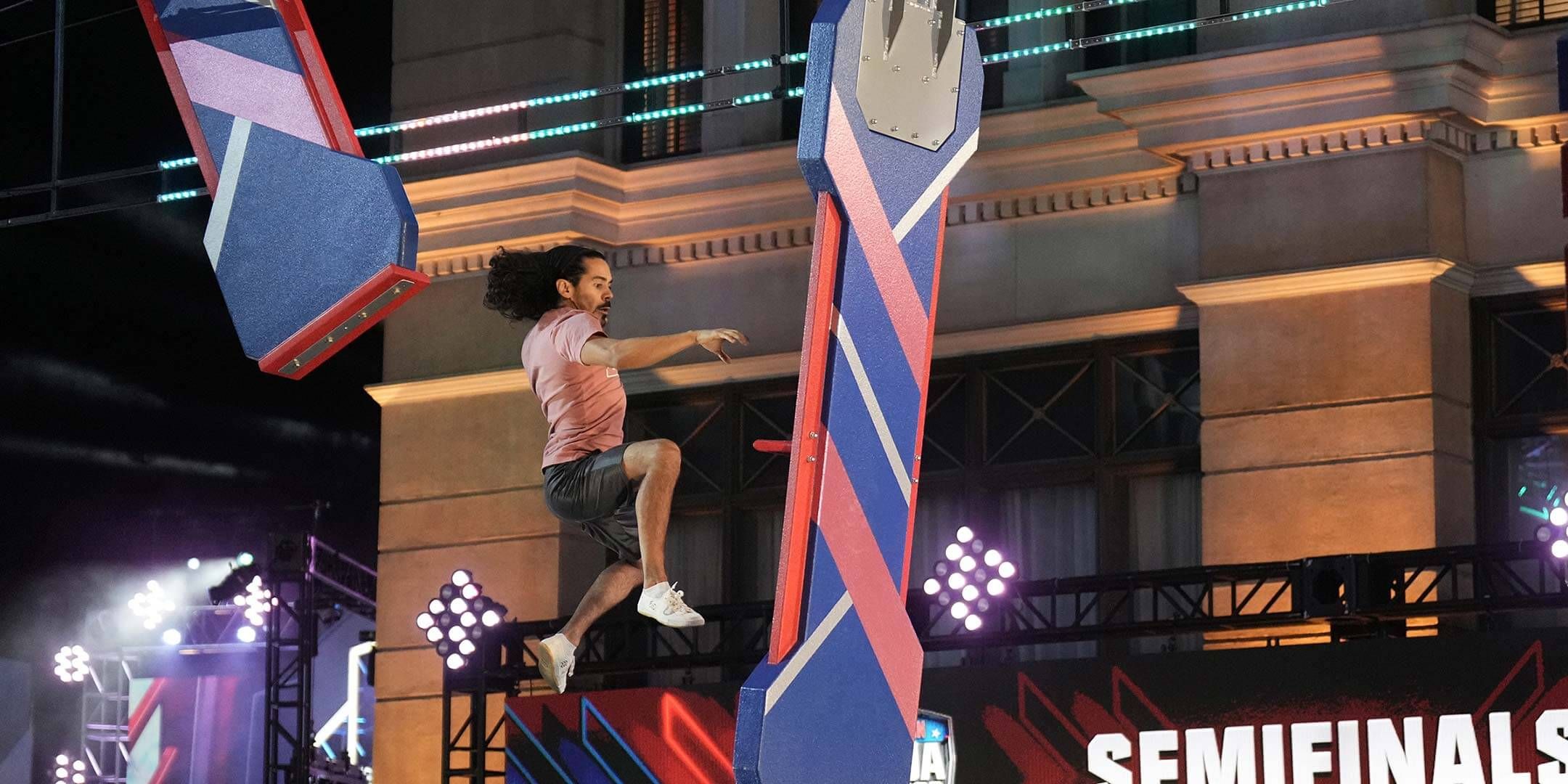 ANW Semifinals Promo Shot: Jay Flores ’12 completes “Lunatic Ledges” during the American Ninja Warrior semifinals in Los Angeles. Credit: Getty Images