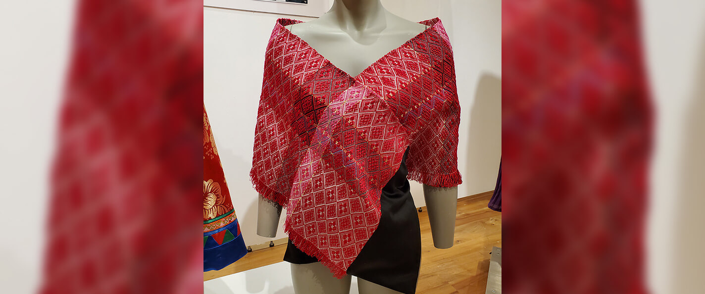 An embroidered shawl designed by Angel Yang.