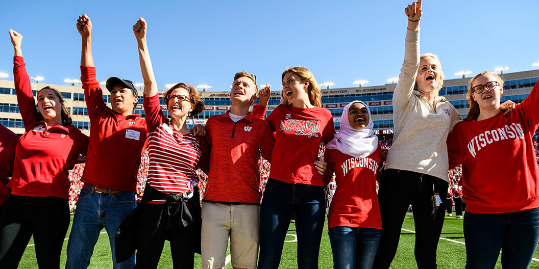 Badger fans on the field at Camp Randall