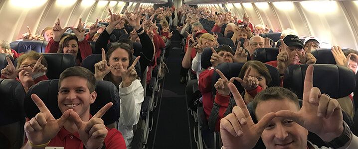 Badgers fans on airplane headed to Miami.